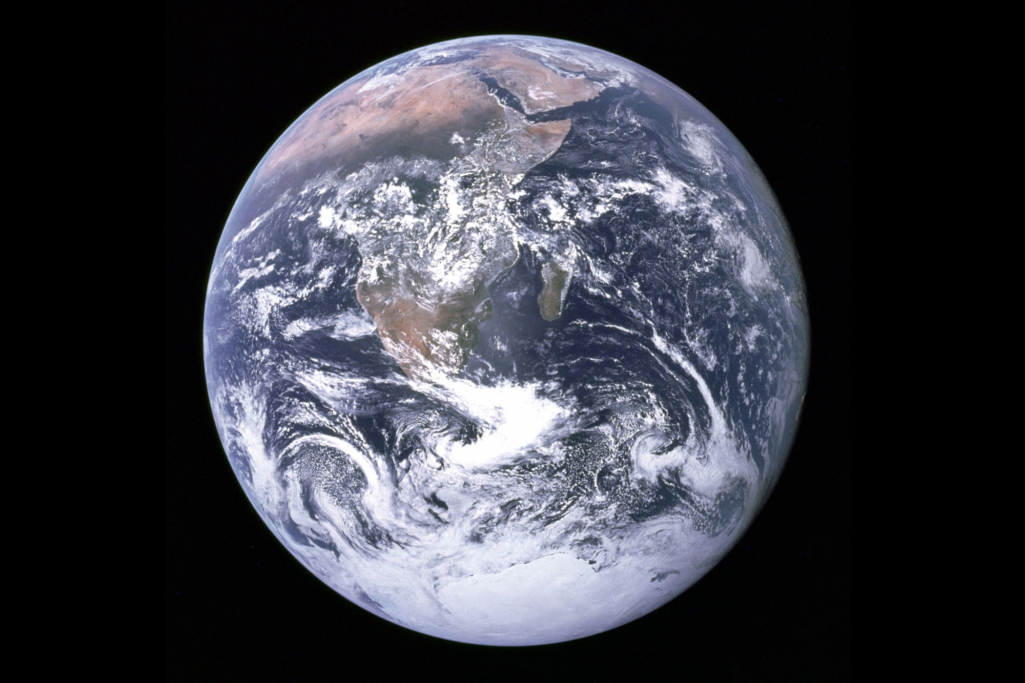 "The Blue Marble" is a famous photograph of the Earth taken taken in 1972 by the crew of the Apollo 17 spacecraft en route to the Moon. It shows Africa, Antarctica, and the Arabian Peninsula.